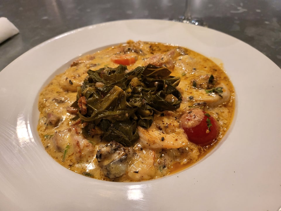 Shrimp and grits topped with collard greens at The 5 Spot Sandfly.