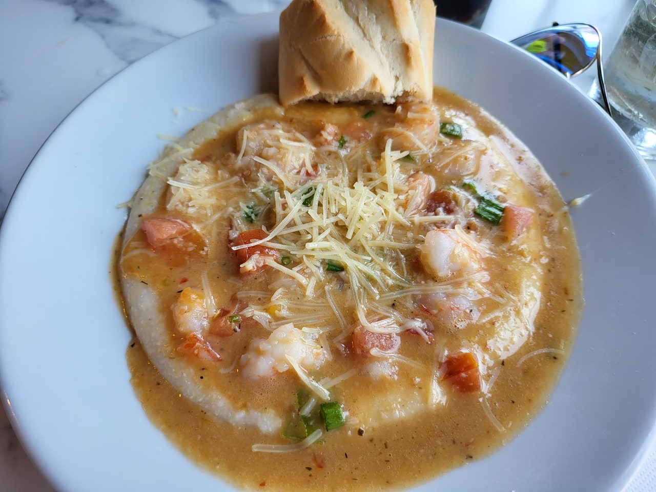 Shrimp and grits with parmesan and bread at Huey's on the River.
