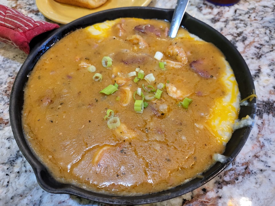 Shrimp and grits in a skillet at J. Christopher's.