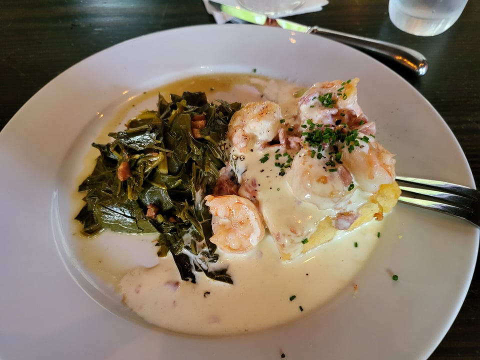 Shrimp, grit cake, and collard greens at The Olde Pink House.