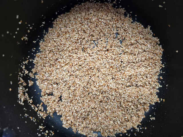 Grits toasted to a deep brown in the pan