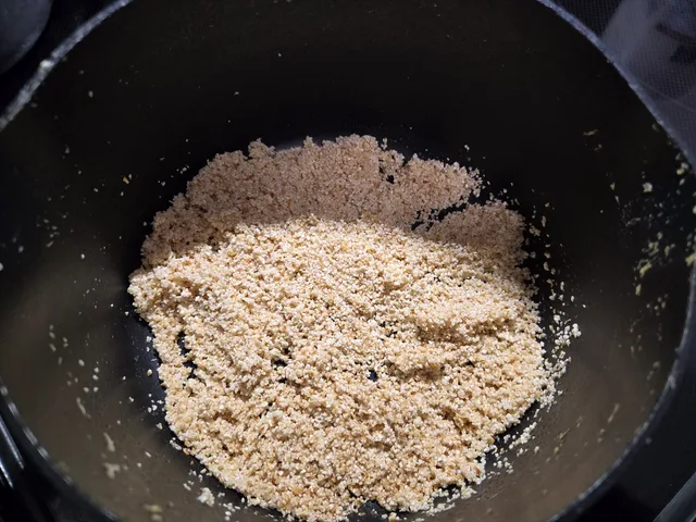 Dry grits just starting to toast in butter, pale and sandy