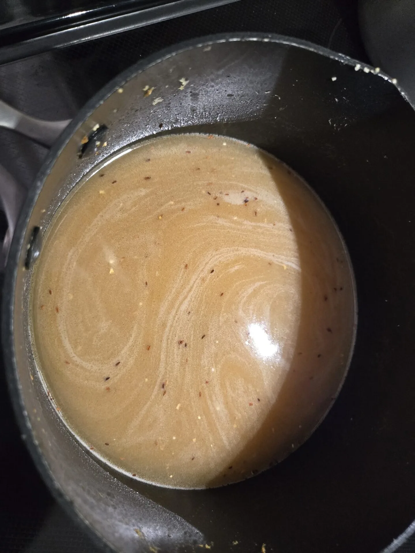 Water just added to the toasted grits in the pot
