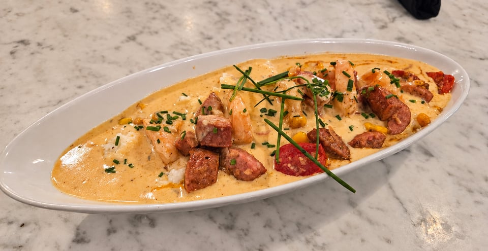 Shrimp and grits with sausage and cream sauce at Vic’s River Grill